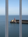 SX03000 Lighthouse of Rosslare harbour through ferry railing.jpg